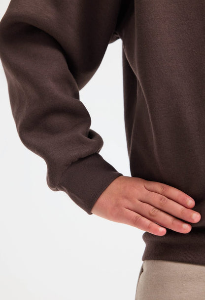 Uneek UC206 childrens V neck sweatshirt modelled