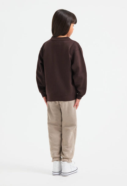 Uneek UC206 childrens V neck sweatshirt modelled