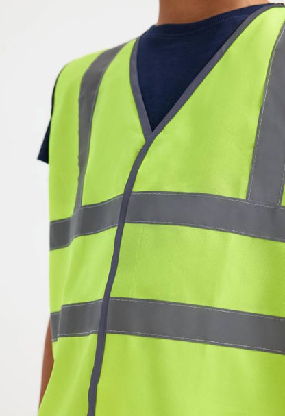 Uneek UC806 childrens hi-viz waistcoat modelled